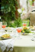 Laid table with spring flowers out of doors