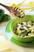 Courgette salad in green bowl