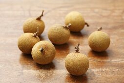 Several longans on wooden background