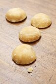 Palm sugar on wooden background