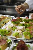 Assorted canapes on silver platters