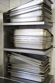 Stainless steel roasting tins, stacked