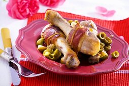 Ham-wrapped chicken drumsticks with olives
