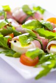 Mozzarella with Parma ham, tomatoes, basil and rocket