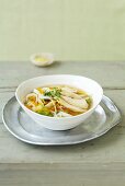 Lemon and ginger soup with chicken and rice ribbon noodles