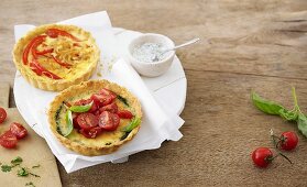 Onion and pepper tart and basil and cherry tomato tart