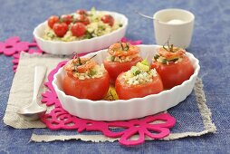 Tomatoes stuffed with rice, peas and courgettes
