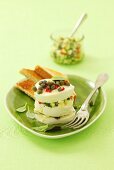 Mozzarella tower with capers and courgette salad