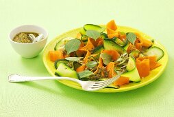 Courgette and carrot salad with pesto and sunflower seeds