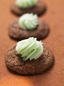 Chocolate macaroons with green cream