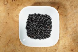 Beluga lentils in dish from above