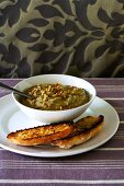 Aubergine and garlic dip with pine nuts, toasted bread