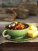 Chili in a Green Bowl with Cornbread