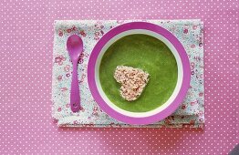 Asparagus puree with heart-shaped piece of ham