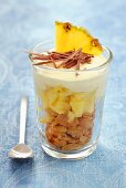 A layered dessert with cornflakes, pineapple and yogurt