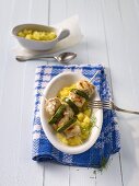 Monk fish and courgette kebabs on a bed of pineapple