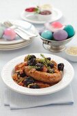 Sausages with prunes and onions