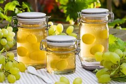 Jars of grape jelly and green grapes