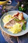 Bass with leek sauce and potato wedges