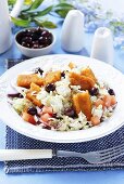 Vegetable salad with fish fingers and olives