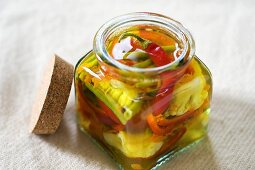 Achards (French spicy vegetable pickle) in jar