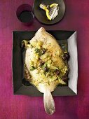 Plaice with lemon and olive sauce