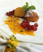 Pumpkin fritters with sauce and redcurrants