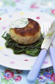 Fish cake on spinach