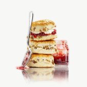 Fruit scones with jam, in a pile