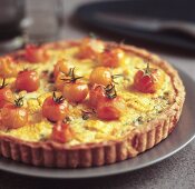 Sweetcorn and spring onion tart with cocktail tomatoes