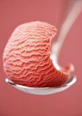 Strawberry ice cream on a spoon
