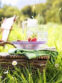 Picnic basket with picnicware and radishes