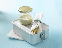 Lunch box, cutlery and dressing in screw-top jar