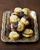 Filled piped biscuits with chocolate icing