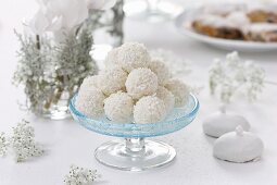 Coconut truffles on a glass pedestal stand