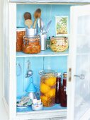 Preserved fruit and vegetables in a cupboard
