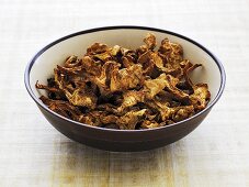 Dried chanterelle mushrooms in a bowl