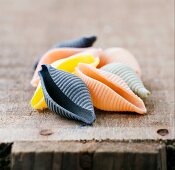 Coloured conchiglie on a wooden crate