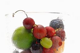 Various types of fruit in a misted glass