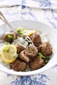 Meat balls with lemon on a bed of rice