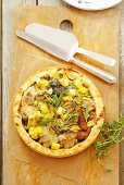 Leek and mushroom tart with herbs, seen from above