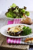 Stuffed aubergines topped with melted cheese