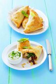 Puff pastry samosas stuffed with chicken, spinach and raisins
