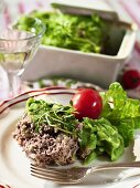 Minced meat bake with mashed herb potatoes and cress