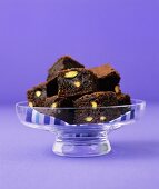 Pistachio brownies in a glass dish