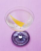 A glass of Martini with lemon