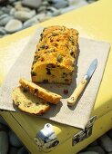 Olive and bacon bread, partly sliced