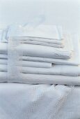 A pile of white tablecloths