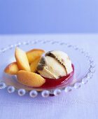 Poached peaches with ice cream on raspberry sauce