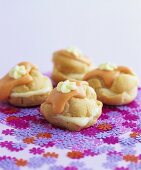 Choux pastries with orange icing